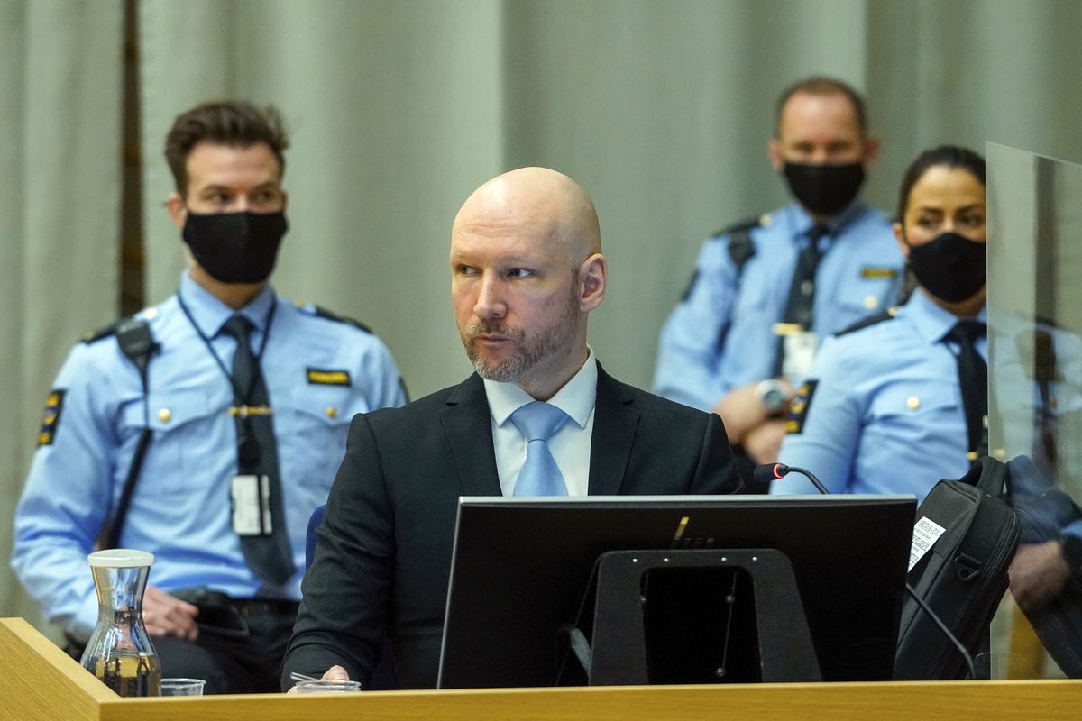 Norwegian mass killer Anders Behring Breivik sits in the makeshift courtroom in Skien prison on the second day of his hearing where he is requesting release on parole, in Skien, Norway, Wednesday, Jan. 19, 2022. Breivik, the far-right fanatic who killed 77 people in bomb-and-gun massacres in 2011, argued Tuesday for an early release from prison, telling a parole judge he had renounced violence even as he professed white supremacist views and flashed Nazi salutes.  (Ole Berg-Rusten)