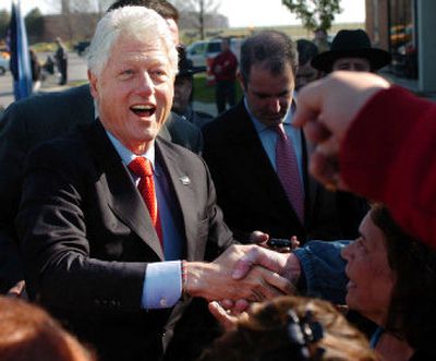 
Former President Bill Clinton greets supporters during a rally  Monday in Oriskany, N.Y. 
 (Associated Press / The Spokesman-Review)