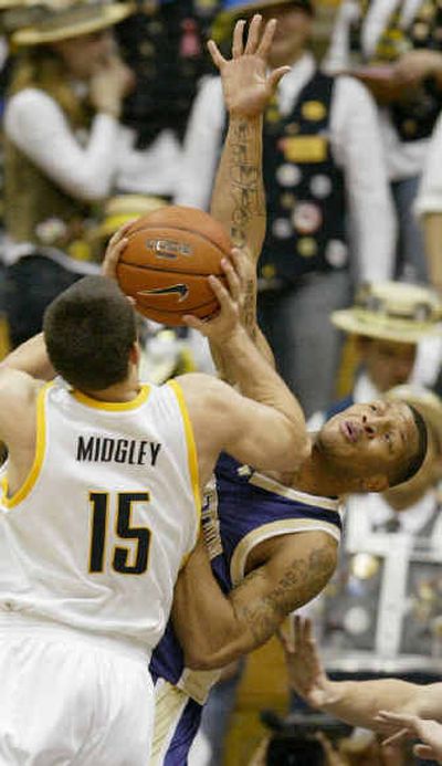 
Washington's Will Conroy, right, defends against California's Richard Midgley in the first half Thursday. 
 (Associated Press / The Spokesman-Review)