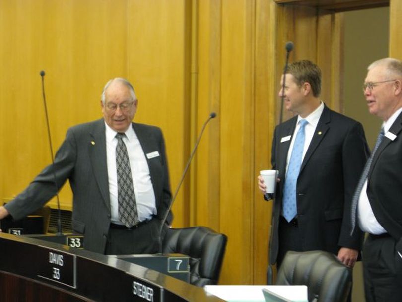 Substitute Sen. Bob Geddes - father of Senate President Pro-tem Bob Geddes, for whom he's substituting this week - talks with Sens. John McGee, R-Caldwell, and Denton Darrington, R-Declo, right. The senior Geddes is a former longtime state representative and co-chairman of the Legislature's joint budget committee. (Betsy Russell / The Spokesman-Review)