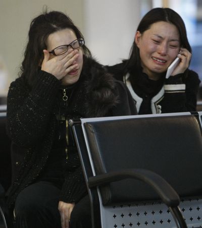 Family members of South Korean  naval crews weep as they wait to board a ship in Incheon today.  (Associated Press)