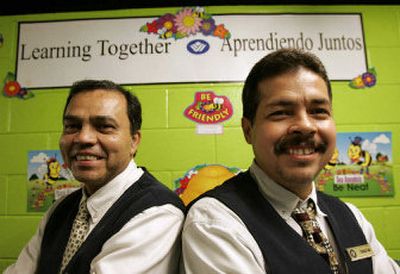 
Wyndham Anatole Hotel employees Juan Godinez, left, and Francisco Casas. Both men have completed an English learning course using LeapPad technology provided to them by the Wyndham Anatole Hotel company. 
 (Associated Press / The Spokesman-Review)