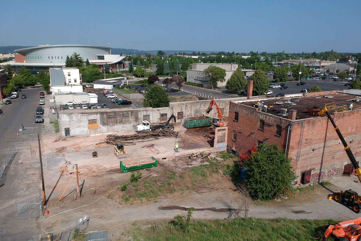 The old warehouse, at right, facing West Dean Avenue near the Spokane Arena shown May 31, was most recently a dance studio, later a horse stable associated with the dairy industry is being prepared for demolition to make way for the future Sportsplex being planned by the Public Facilities District, the organization which operates the Spokane Arena and the Spokane Convention Center. (Jesse Tinsley / The Spokesman-Review)