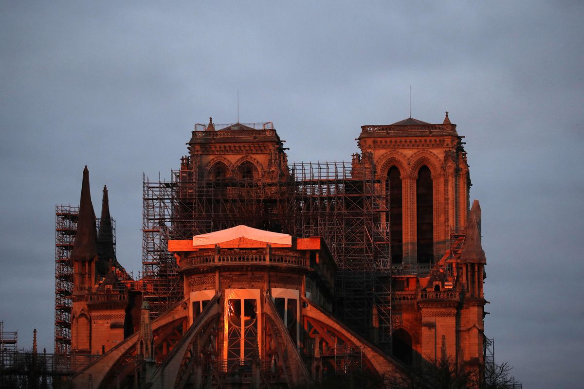 Notre Dame cathedral is pictured when the sun rises, in Paris, on Sunday, Jan. 5, 2020. Gen. Jean-Louis Georgelin who is overseeing the reconstruction of the fire-devastated Notre Dame Cathedral told French broadcaster CNews on Sunday that “the cathedral is still in a state of peril” after last year’s fire, which destroyed its roof and collapsed its spire as the cathedral was undergoing renovations. (Christophe Ena / Associated Press)