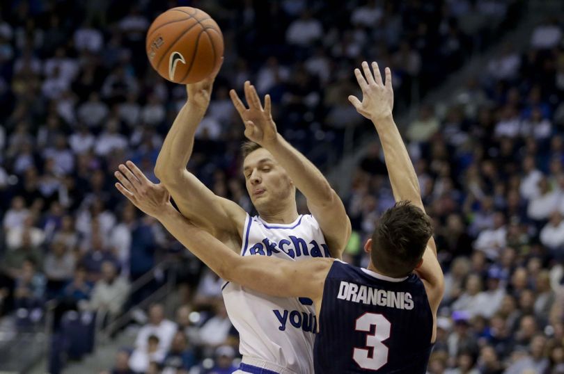 BYU guard Kyle Collinsworth is fouled by Gonzaga guard Kyle Dranginis  during the Bulldogs’ 71-68 win on Saturday night in Provo, Utah. (Dominic Valente / Associated Press)