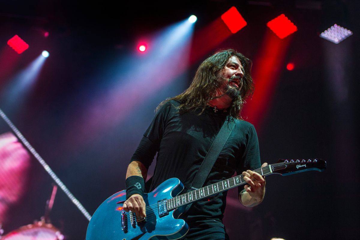 Foo Fighters’ front man Dave Grohl plays to the crowd during “All My Life,” on Dec. 4, 2017, in the Spokane Arena.  (DAN PELLE)