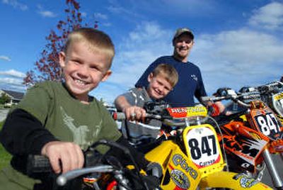 
Jimmy Lamastus, right, has been a motocross racer since he was 5. He is now getting his kids, Carson, 6, and Holden, 4, involved in racing as he gets out. 
 (Jesse Tinsley / The Spokesman-Review)