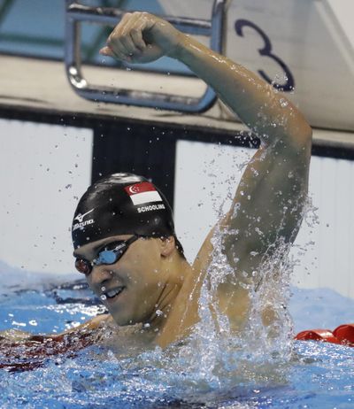 Singapore’s Joseph Schooling was handsomely rewarded for his victory in the men’s men's 100-meter butterfly. (Julio Cortez / Associated Press)