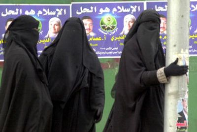 
Female supporters of the Muslim Brotherhood stand outside a polling station in Cairo's suburb of Nasr City before voting Tuesday in Egypt's runoff parliamentary elections.  
 (Associated Press / The Spokesman-Review)