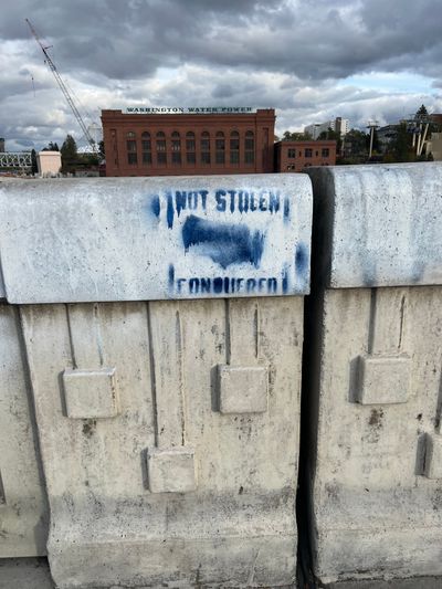 Graffiti affiliated with the white supremacist Patriot Front group was found on the Monroe Street Bridge on Oct. 25.  (By Quinn Welsch)