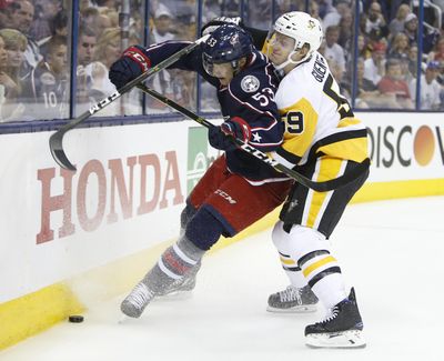 Pittsburgh Penguins' Jake Guentzel, right, checks Columbus Blue Jackets' Gabriel Carlsson, of Sweden, during the first period in Game 3 of a first-round NHL hockey playoff series, Sunday, April 16, 2017, in Columbus, Ohio. (Jay LaPrete / Associated Press)