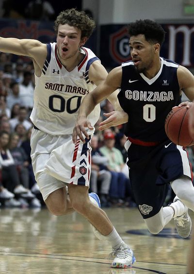 Gonzaga's Silas Melson, right, drives the ball against Saint Mary's Tanner Krebs (00) during the second half of an NCAA college basketball game Saturday, Feb. 11, 2017, in Moraga, Calif. (AP Photo/Ben Margot) ORG XMIT: CABM113 (Ben Margot / AP)