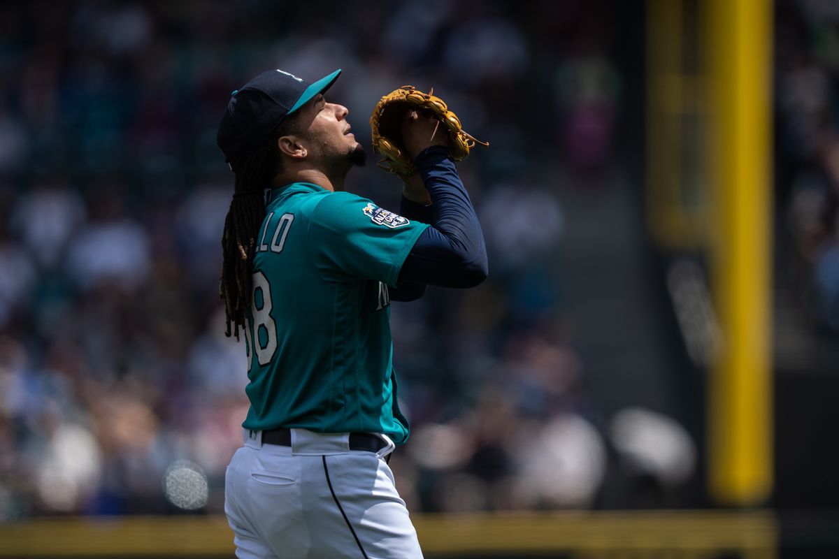 A Seattle Mariners fan wearing a Cal Raleigh jersey with Raleigh's