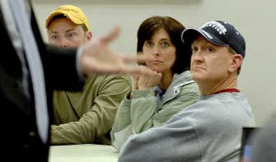 
Centennial Distributing employees Bryant Pooley, left, along with Jim and Paula Krieger, attended the first of three basic finance sessions given by D. A. Davidson at their plant in Hayden.  
 (Photos by KATHY PLONKA / The Spokesman-Review)