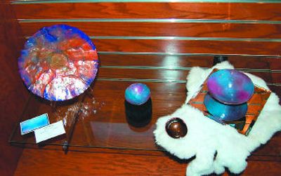 
Lane Russell fires her enameled pieces up to 10 times to temperatures reaching 1,700 degrees. 
 (Wayne Cridland / The Spokesman-Review)