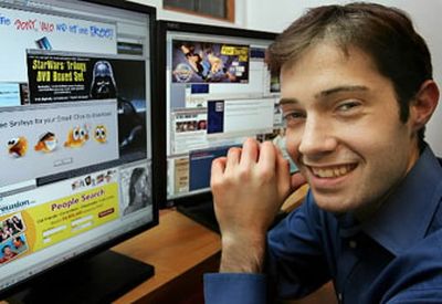 
Internet researcher and Harvard grad student Benjamin Edelman sits next to computer screens with pop-up ads. Edelman says an Ask Jeeves toolbar generates ads without users' full consent, while Google's search listings appear in queries made through a questionable third-party toolbar. 
 (Associated Press / The Spokesman-Review)