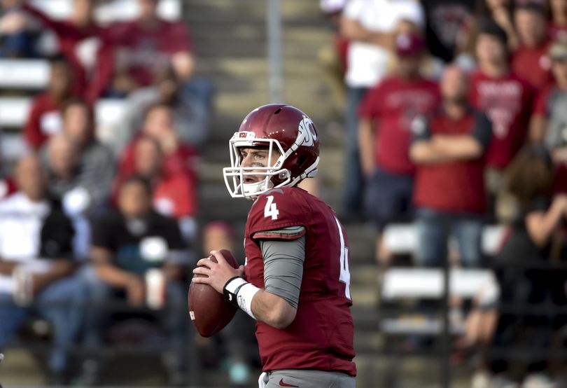Washington State quarterback Luke Falk (4) looks for an open teammate Oregon State during the second half of a PAC 12 football game on Saturday, Oct 17, 2015, at Martin Stadium in Pullman, Wash. (Tyler Tjomsland / The Spokesman-Review)
