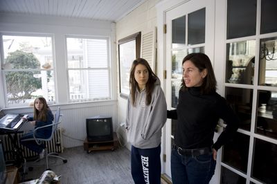 Mary Quinn, 48, right, of Greenwich, Conn., is seen at her home with her daughters Paulina 11, left, and Isabelle, 17, at their home. Quinn, laid off in December from her job in the financial industry, is actively seeking work but in the meantime savoring her unexpected time with her daughters.  (Associated Press / The Spokesman-Review)
