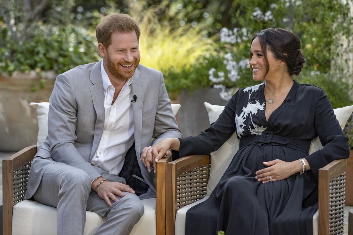This image provided by Harpo Productions shows Prince Harry, left, and Meghan, Duchess of Sussex, speaking about expecting their second child during an interview with Oprah Winfrey. "Oprah with Meghan and Harry: A CBS Primetime Special" airs March 7 as a two-hour exclusive primetime special on the CBS Television Network.  (Joe Pugliese)