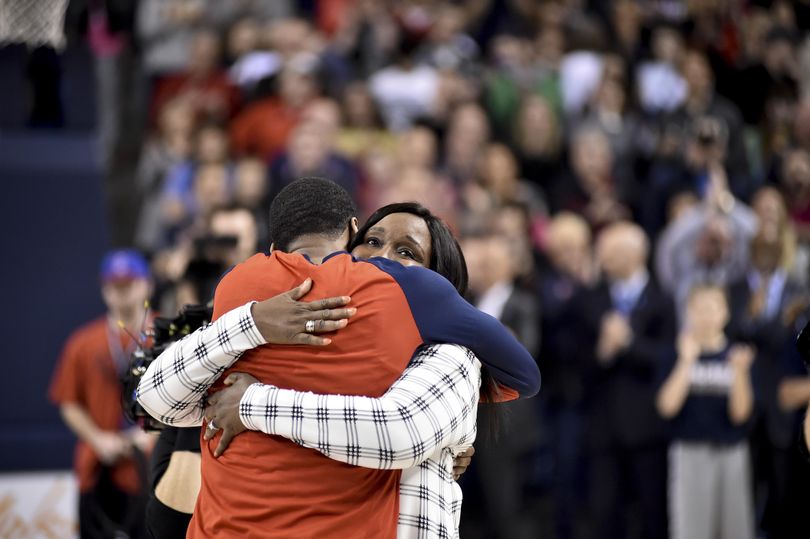 Gonzaga guard Eric McClellan (23) embraces his mother on senior night before facing Saint Mary's during the first half of a college basketball game on Saturday, Feb 20, 2016, at The McCarthey Athletic Center in Spokane, Wash. (Tyler Tjomsland / The Spokesman-Review)