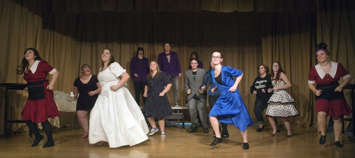 The cast dances and sings their way through the opening scene of the East Valley High School drama production of “The Wedding Singer” during rehearsal March 6 at Trent Elementary. (Jesse Tinsley)