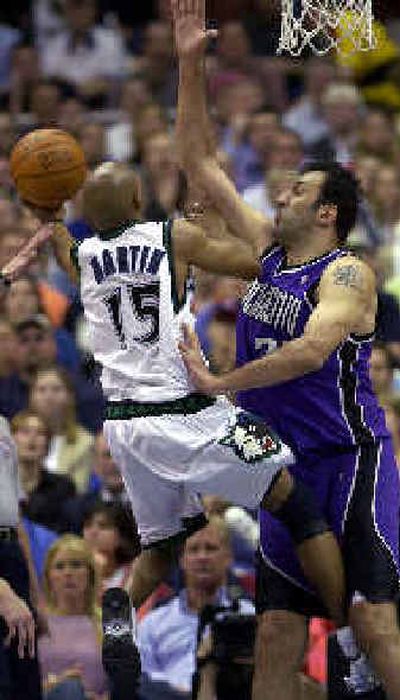 
Darrick Martin is fouled by Vlade Divac.Darrick Martin is fouled by Vlade Divac.
 (Associated PressAssociated Press / The Spokesman-Review)