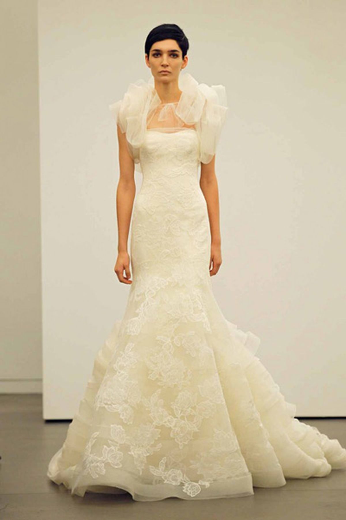 Strapless mermaid floating lace gown over web lace with horsehair and tulle shrug. Vera Wang/Dan Lecca