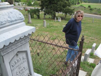 Kathy Babb, the secretary of the Cheney Cemetery Association, listens to the story of the Cox family at Fairview Cemetery last Saturday.  (Lisa Leinberger / The Spokesman-Review)