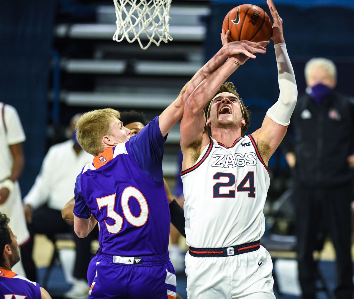 Gonzaga forward Corey Kispert (24) battles Northwestern State guard Trenton Massner (30), Monday, Dec. 21, 2020, in the McCarthey Athletic Center.  (Dan Pelle/THESPOKESMAN-REVIEW)