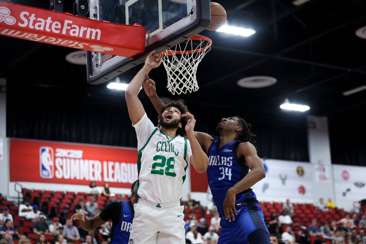Boston Celtics forward Anton Watson battles inside with Dallas Mavericks forward Isaiah Whaley during an NBA summer league game at Cox Pavilion on July 19 in Las Vegas. (Tribune News Service)