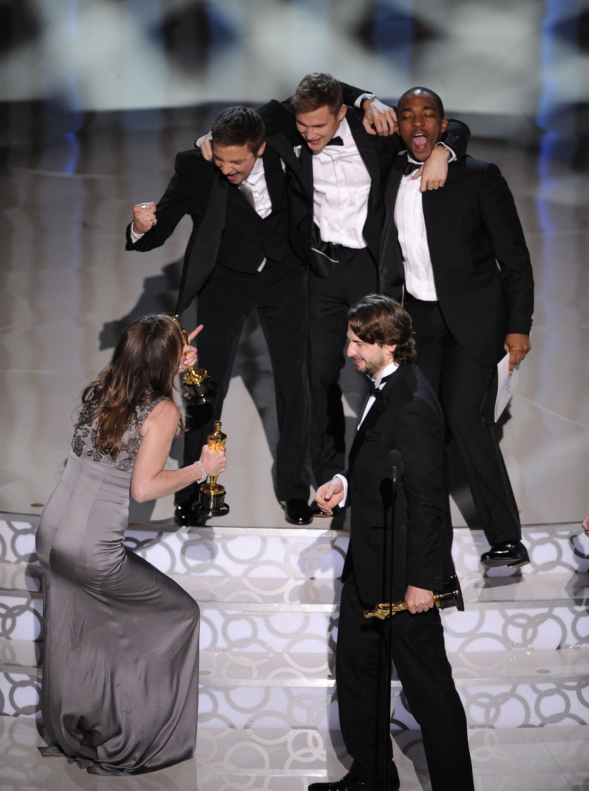 In foreground, Kathryn Bigelow, left,  and Mark Boal,  celebrate with cast of "The Hurt Locker" as they accept the Oscar for best motion picture of the year at the 82nd Academy Awards Sunday, March 7, 2010, in the Hollywood section of Los Angeles. In background from left are Jeremy Renner, Brian Geraghty  and Anthony Mackie. (Mark Terrill / Associated Press)