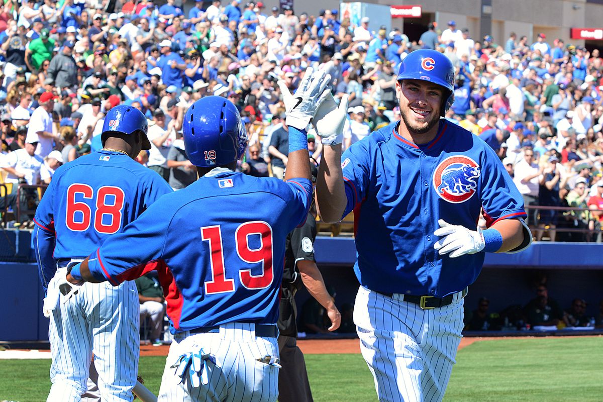 Kris Bryant, right, and agent Scott Boras drew the attention of Couch Slouch when Cubs sent the young slugger to the minors. (Associated Press)