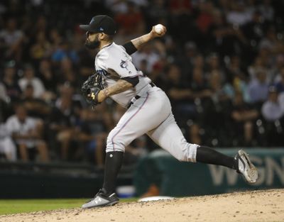 In this July 24, 2019 photo, Miami Marlins relief pitcher Sergio Romo delivers during the ninth inning of a baseball game against the Chicago White Sox in Chicago. (Charles Rex Arbogast / Associated Press)