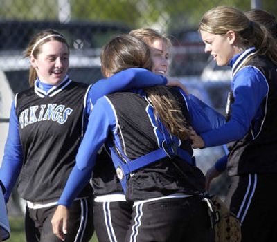 Coeur d'Alene's Lindsey Stark, Jordan Corbey, Heather Helmhout and Jenna DeLong, left to right, celebrate Tuesday's state-clinching win over Lake City.
(Jesse Tinsley / The Spokesman-Review)