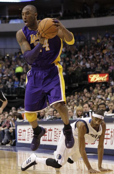 Los Angeles Lakers’ Kobe Bryant (24) grabs a loose ball. (Associated Press)