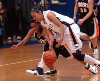 
Mead's Kristina Puthoff, right, and LC's Brittany Kennedy scramble after loose ball in Friday's game. 
 (Jesse Tinsley / The Spokesman-Review)