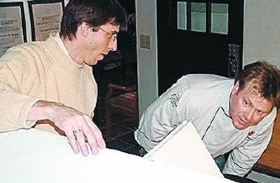 
Mark Van Hise and Christopher Morlan inspect Morlan's design. 
 (Courtesy of Patty Seebeck / The Spokesman-Review)