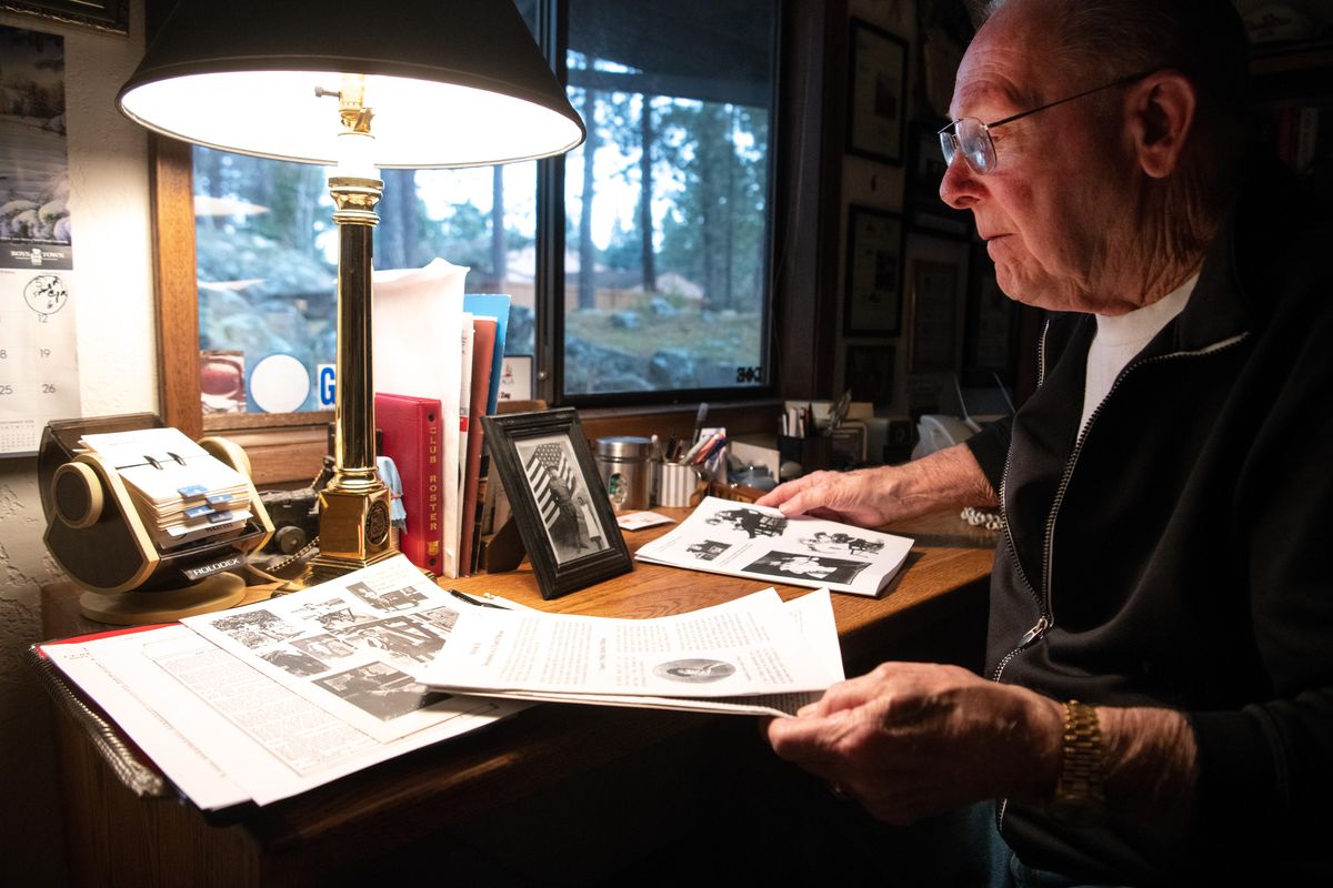Robert O’Brien of Spokane Valley looks through family newsletters and photos from the years around World War I, especially stories surrounding the death of his aunt, Mary Philomena O’Brien, who contracted the flu and died while caring for other flu victims and the war wounded. (Jesse Tinsley / The Spokesman-Review)