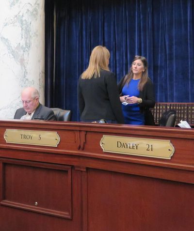 Rep. Heather Scott, R-Blanchard, talks with another representative on the floor of the Idaho House (Betsy Z. Russell / File)