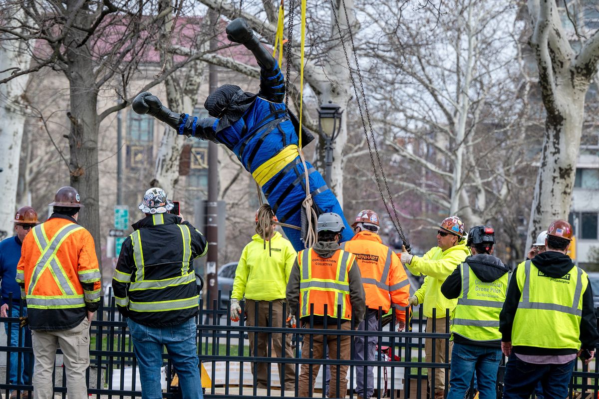 The Rocky statue is removed from the bottom of the Philadelphia Museum of Art steps Wednesday morning March 25, 2026, to be transported inside the museum to be included in an upcoming exhibition. (Tom Gralish/The Philadelphia Inquirer/TNS)