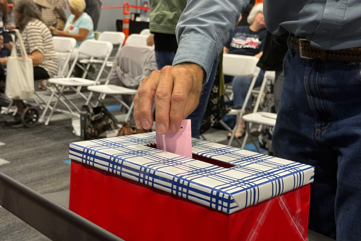 A Spokane County Republican precinct committee officer casts his vote for nominees to lead the Spokane County Prosecutor