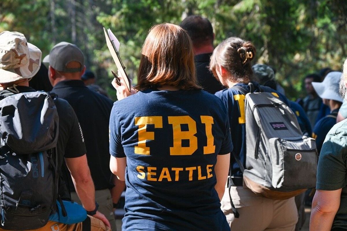 Search crews gather in the Wenatchee National Forest on Monday to search for Travis Decker, the missing suspect wanted in connection with the triple homicide of his daughters.  (Courtesy of FBI Seattle)