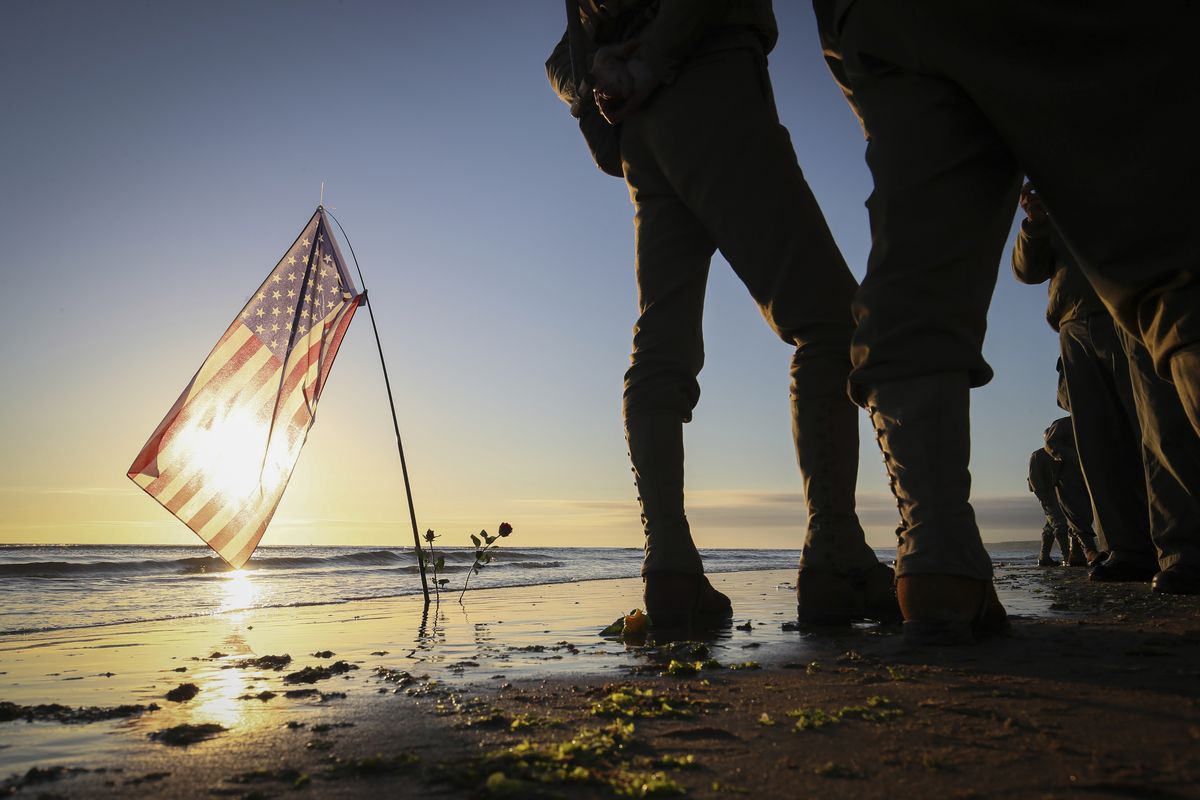 World War II reenactors gather Sunday on Omaha Beach in Saint-Laurent-sur-Mer, Normandy, the 77th anniversary of the assault that helped bring an end to World War II. (David Vincent)
