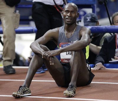 An exhausted Bernard Lagat can smile after setting American record. (Associated Press)