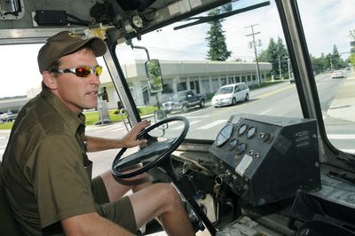 UPS driver Nick Angeleri makes a right turn off Broadway Avenue onto Mullan Road in Spokane Valley on Friday.   (Dan Pelle / The Spokesman-Review)