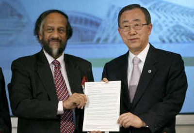 
U.N. Secretary-General Ban Ki-moon,  right, and  Intergovernmental Panel on Climate Change Chairman  Rajendra Pachauri present the panel's synthesis report on climate change after the IPCC XXVII closing ceremony Saturday in Valencia, Spain. Associated Press
 (Associated Press / The Spokesman-Review)