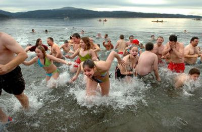 
After the shock of the cold water hits, plungers scream and race back to shore during the annual Polar Bear Plunge at Sanders Beach in Coeur d'Alene on Sunday. 
 (Photos by Jesse Tinsley/ / The Spokesman-Review)