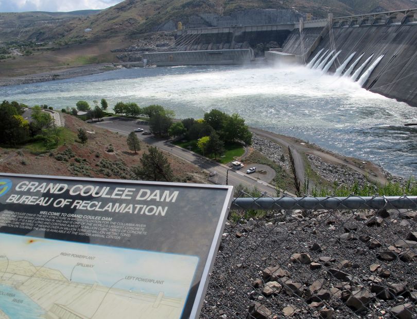 Water is seen being released through the outlet tubes at Grand Coulee Dam. (Associated Press)