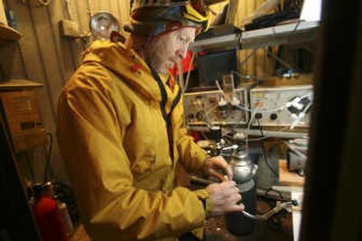 
Dan Jaffe, University of Washington-Bothell professor of atmospheric and environmental chemistry, works in a frigid shelter at the top of Mount Bachelor, Ore., on April 12 as part of his study of  pollution from Asia.Associated Press photos
 (Associated Press photos / The Spokesman-Review)