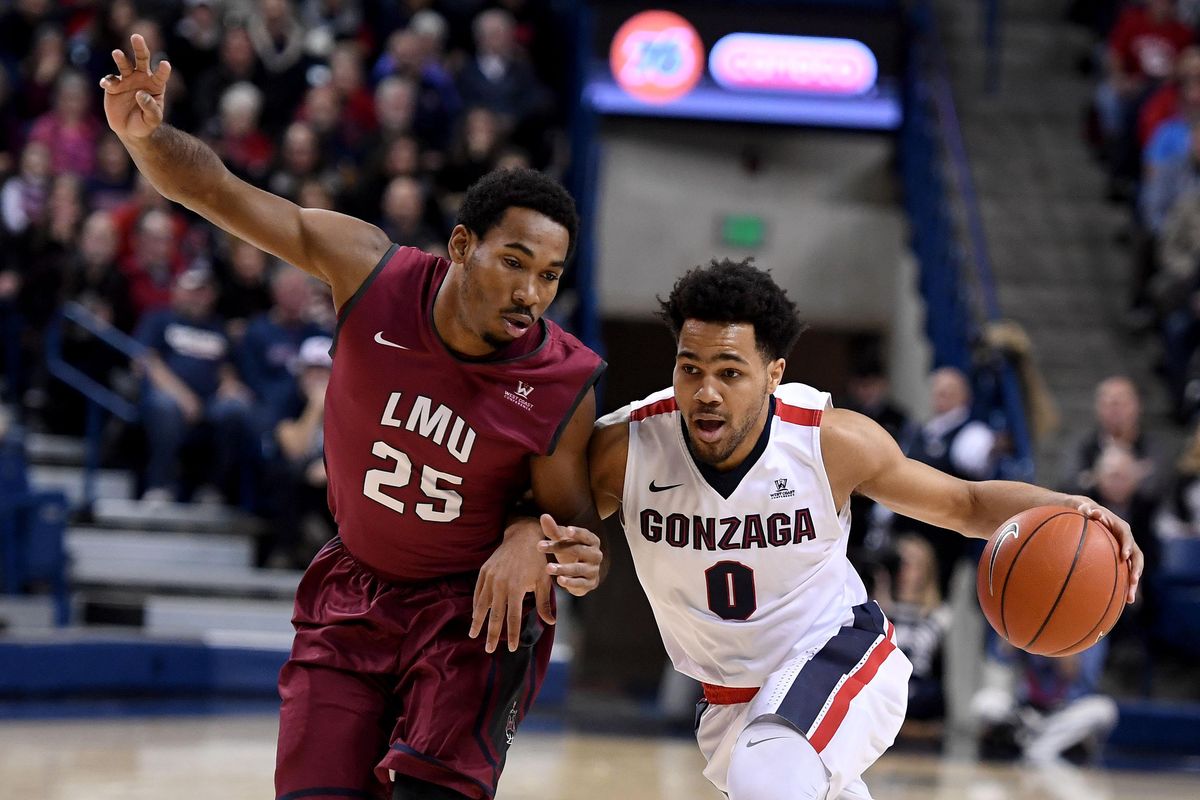 Gonzaga guard Silas Melson  heads downcourt as Loyola Marymount Lions guard Jeffery McClendon defends during the first half of an NCAA college basketball game, Friday, Jan. 12, 2017, at the McCarthey Athletic Center in Spokane. (Colin Mulvany / The Spokesman-Review)